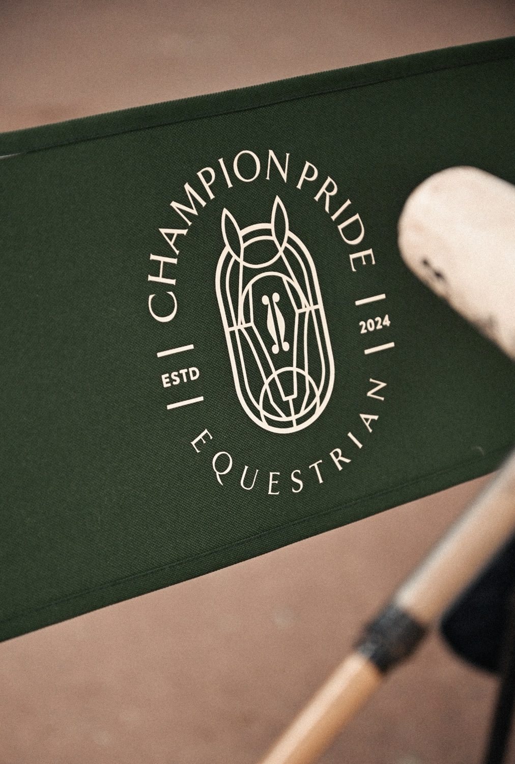 Champion Pride crest on a green director's chair